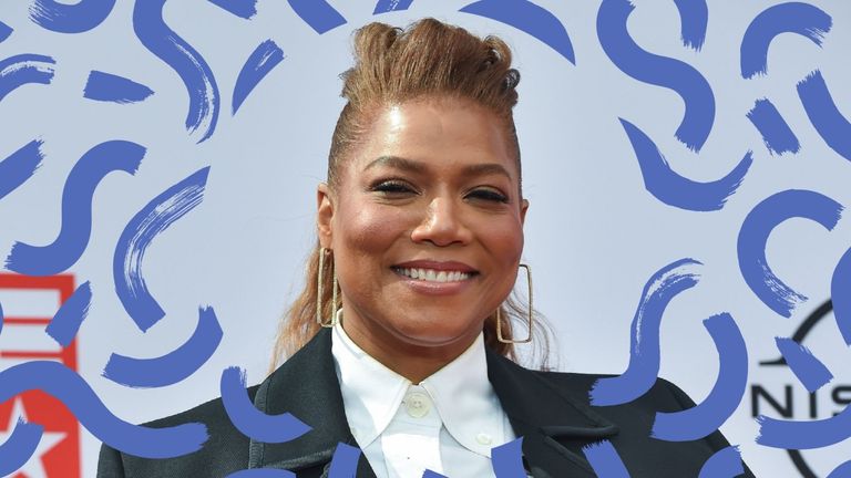 Queen Latifah with a half up half down hairstyles on the red carpet