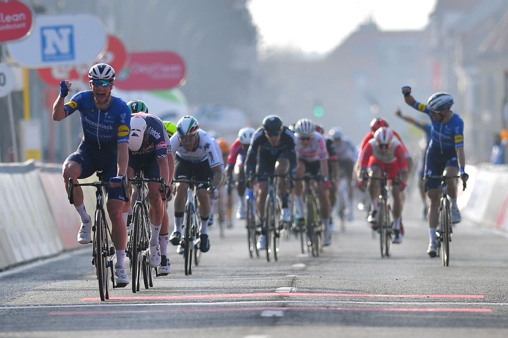 DE PANNE BELGIUM MARCH 24 Arrival Sam Bennett of Ireland and Team Deceuninck QuickStep Celebration Jasper Philipsen of Belgium and Team AlpecinFenix during the 45th Oxyclean Brugge De Panne 2021 Men Classic a 2039km race from Brugge to De Panne OxycleanClassic on March 24 2021 in De Panne Belgium Photo by Luc ClaessenGetty Images