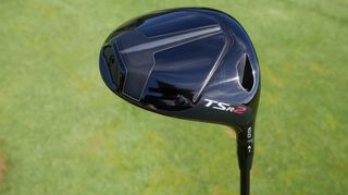 The Titleist TS2 Driver and its sleek clubhead held aloft on the golf course