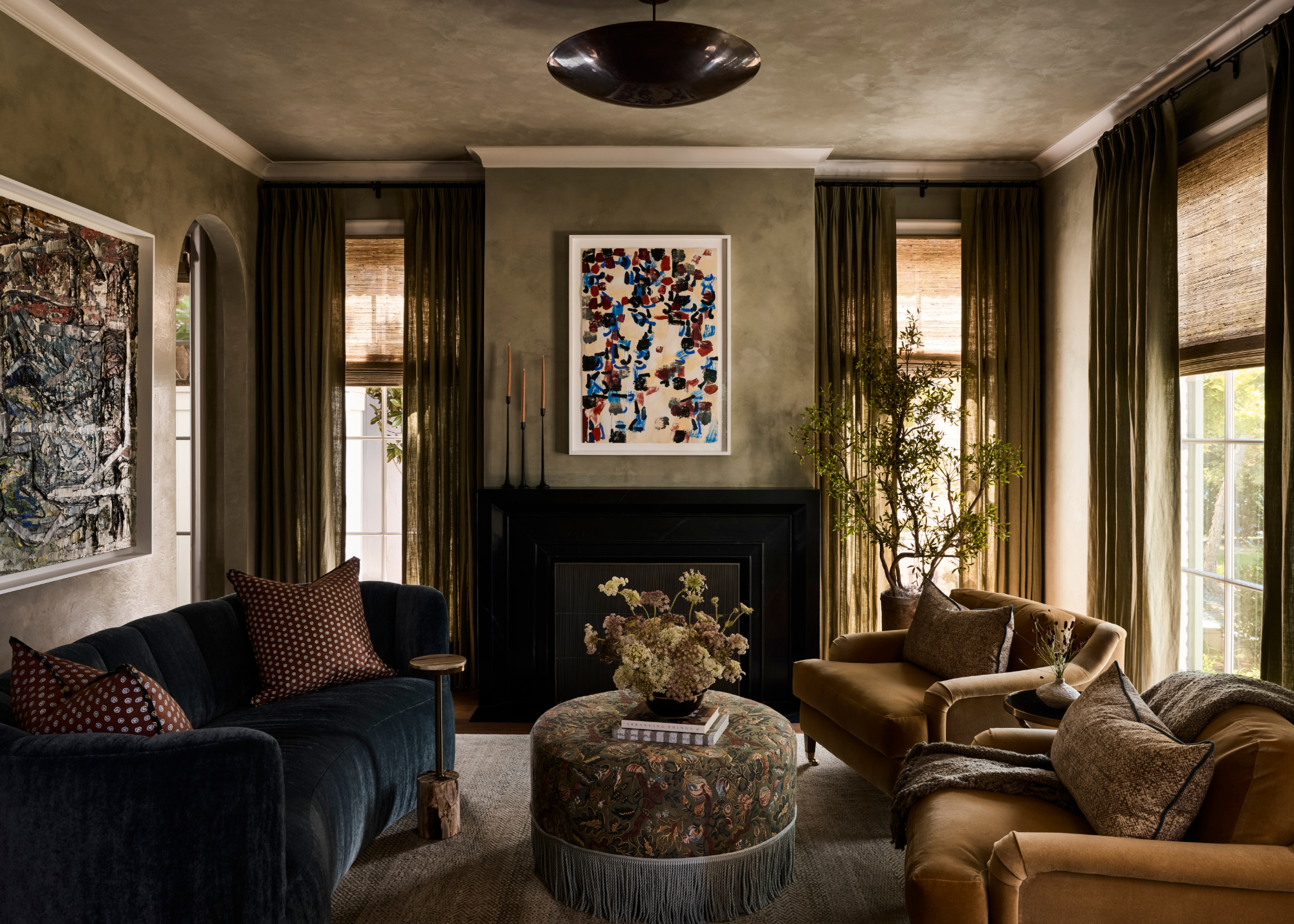 super beautiful moody, earth toned living room with mottled olive green walls and velvet furniture