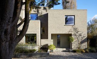 The brick structure is a considered composition of rectangular volumes and voids