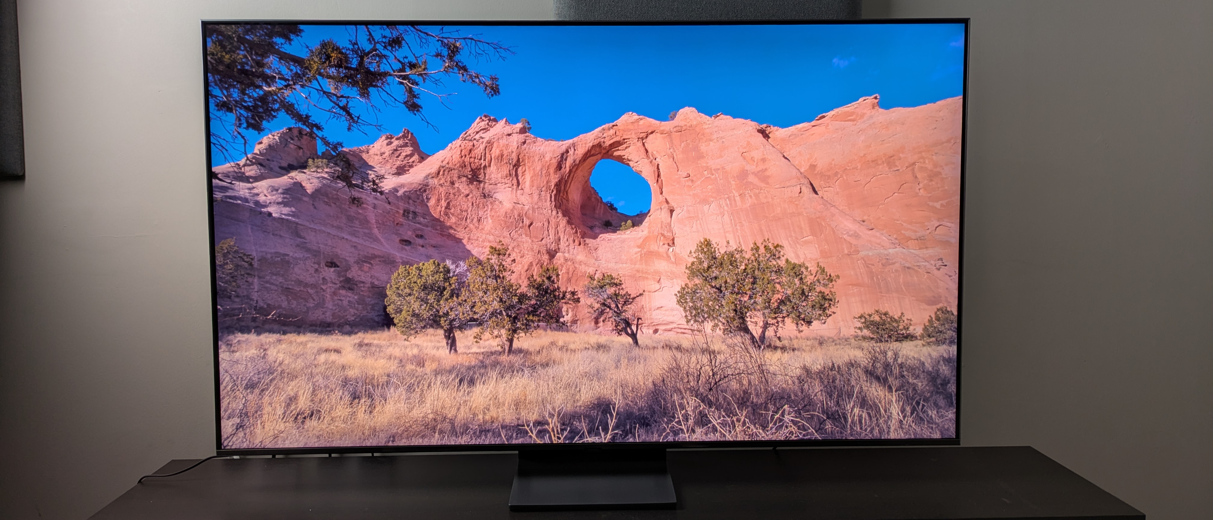 Samsung QN80F hero image with desert cliff on screen 