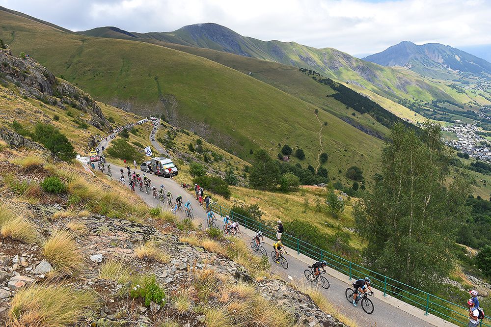 The peloton climbs during stage 20