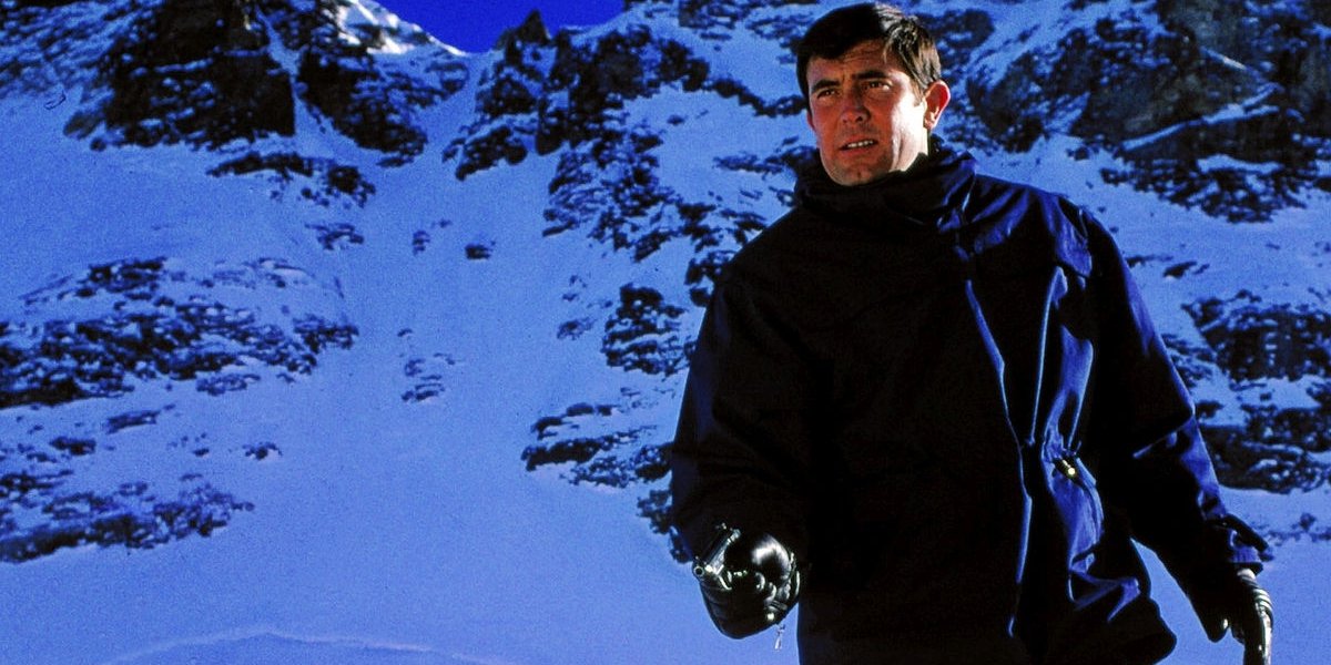 On Her Majesty&#039;s Secret Service George Lazenby aims his gun in the Alps