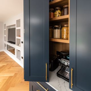 Navy kitchen with pantry
