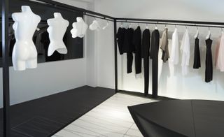 Clothes rail and white mannequins