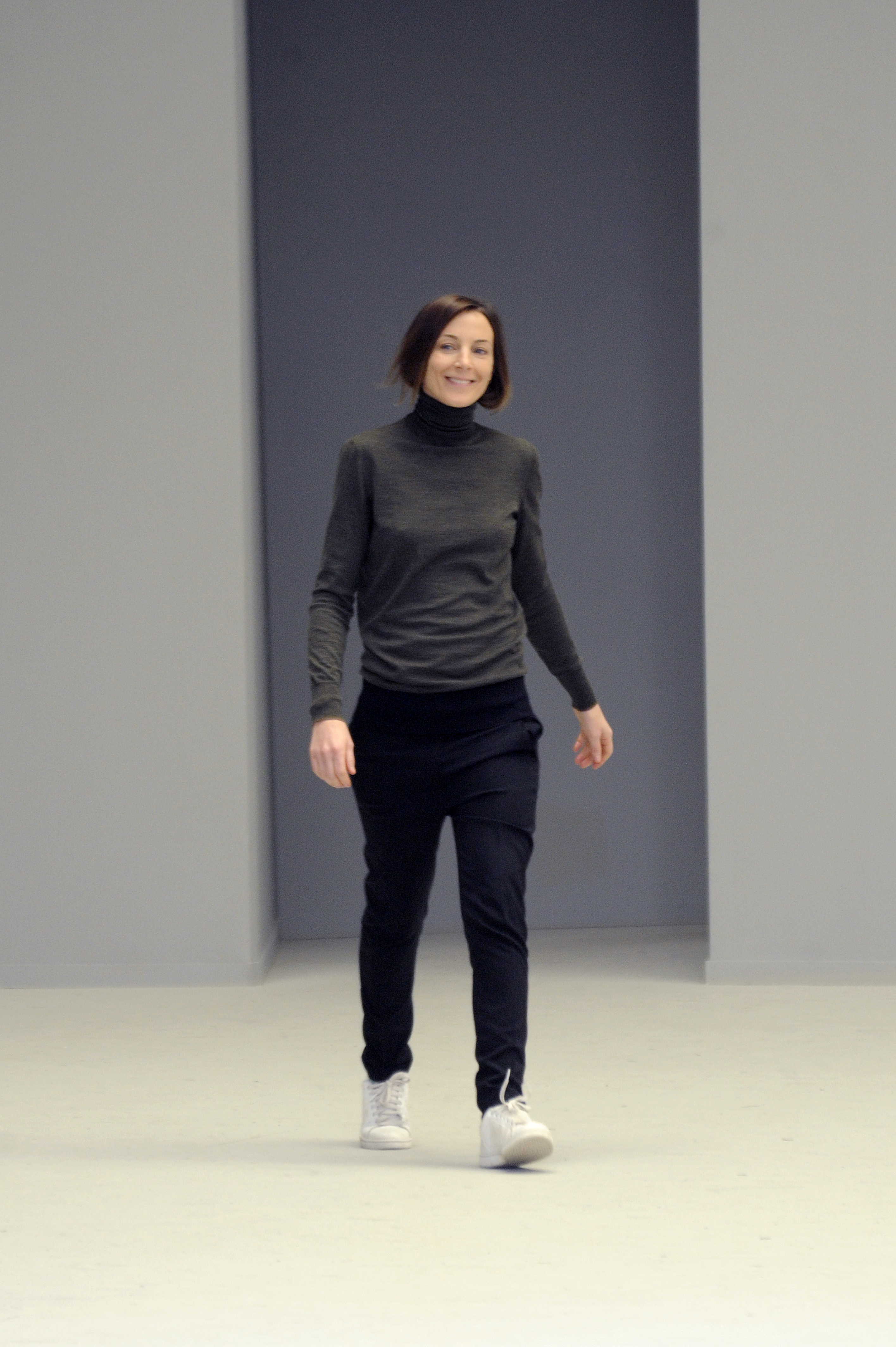 An image of Phoebe Philo wearing a grey turtleneck at Celine&#039;s autumn/winter 2021 show.