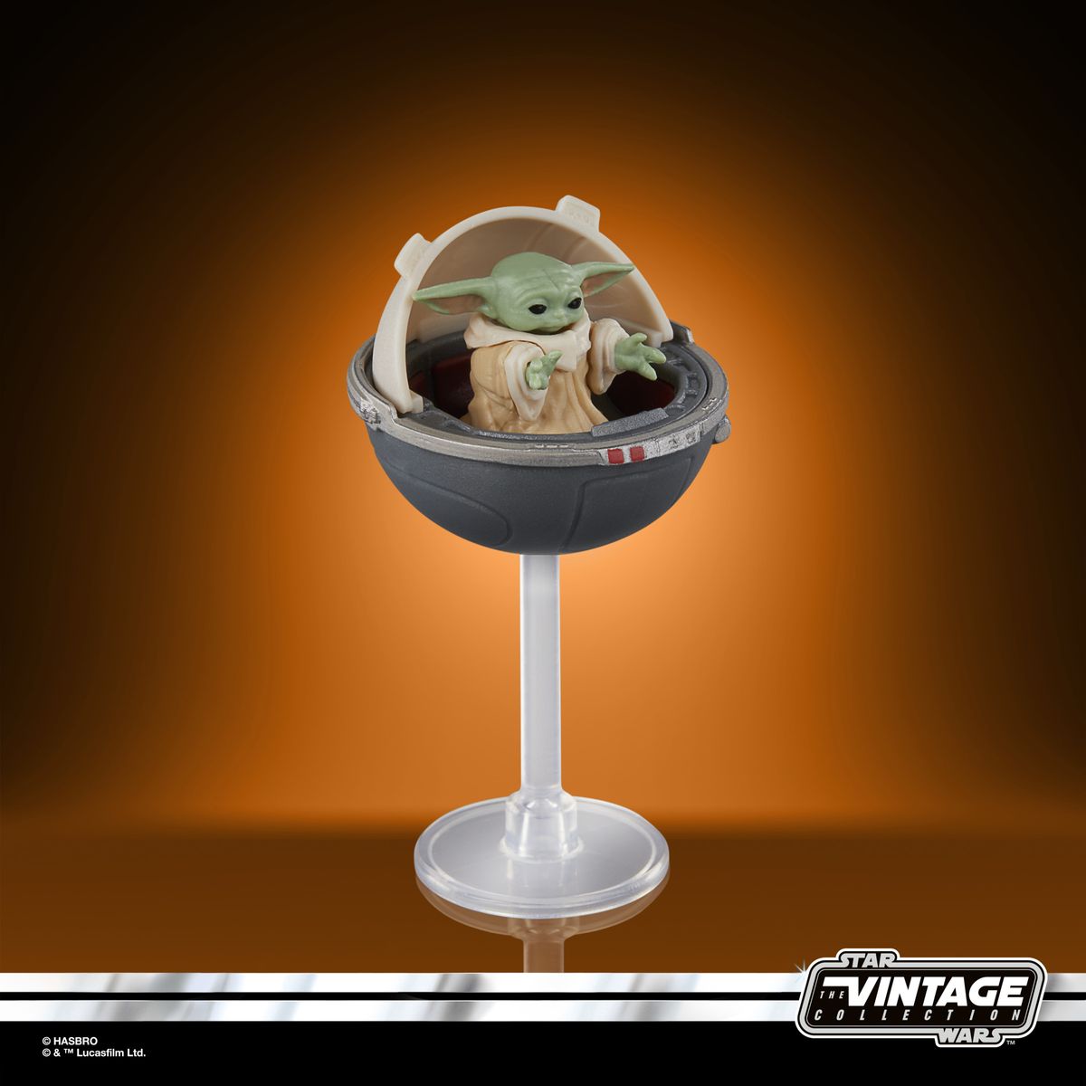 The Vintage Collection Grogu figure on an orange and black background