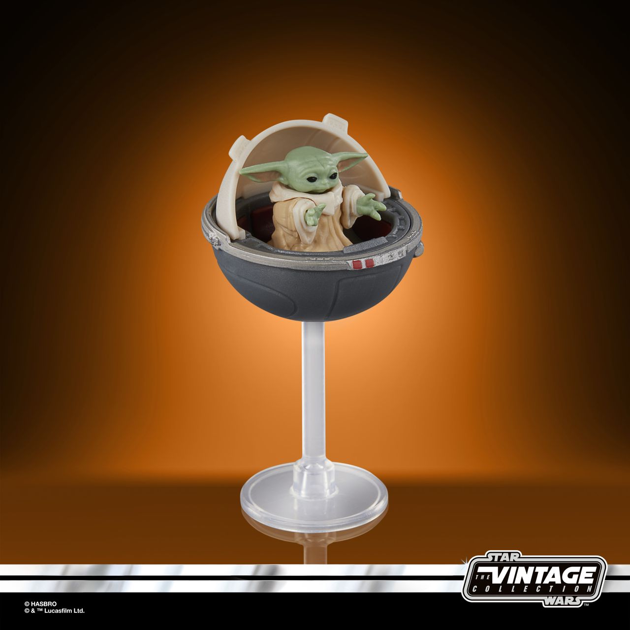 The Vintage Collection Grogu figure on an orange and black background