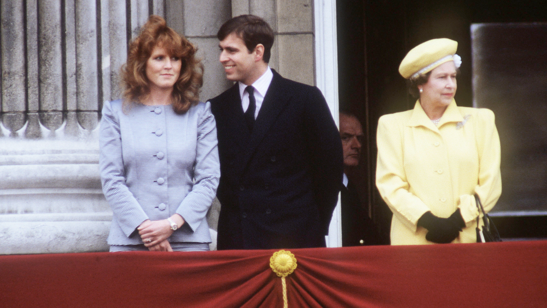 Sarah Ferguson and Prince Andrew posing with Queen Elizabeth on the Buckingham Palace balcony