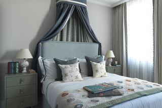 how to design a kid's room A smart children's bedroom using luxurious fabrics and featuring a canopy bed