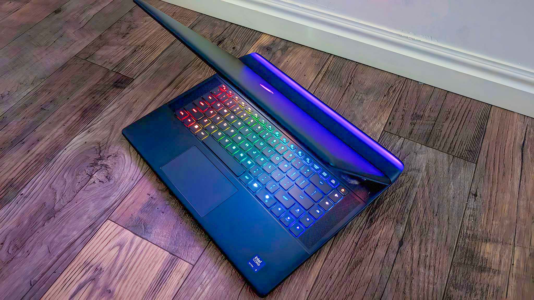 Top down view of the Alienware Area-51 16 gaming laptop with its lid bent forward to see the keyboard and thermal shelf at the same time.