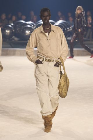 Isabel Marant model carrying a slouchy handbag on the runway