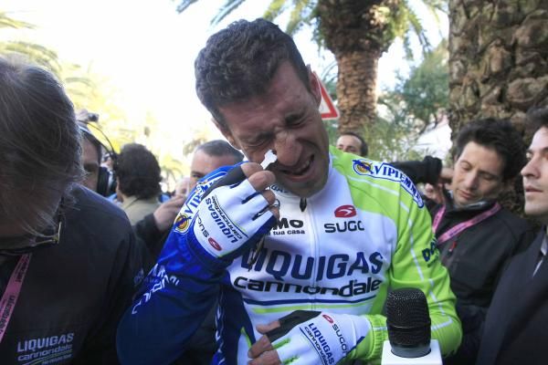 Vincenzo Nibali (Liquigas-Cannondale) peels off his nasal strip before heading to the podium.