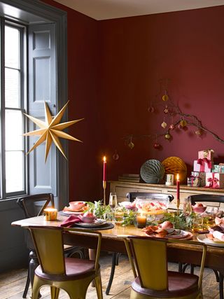 Red dining room decorated with Christmas