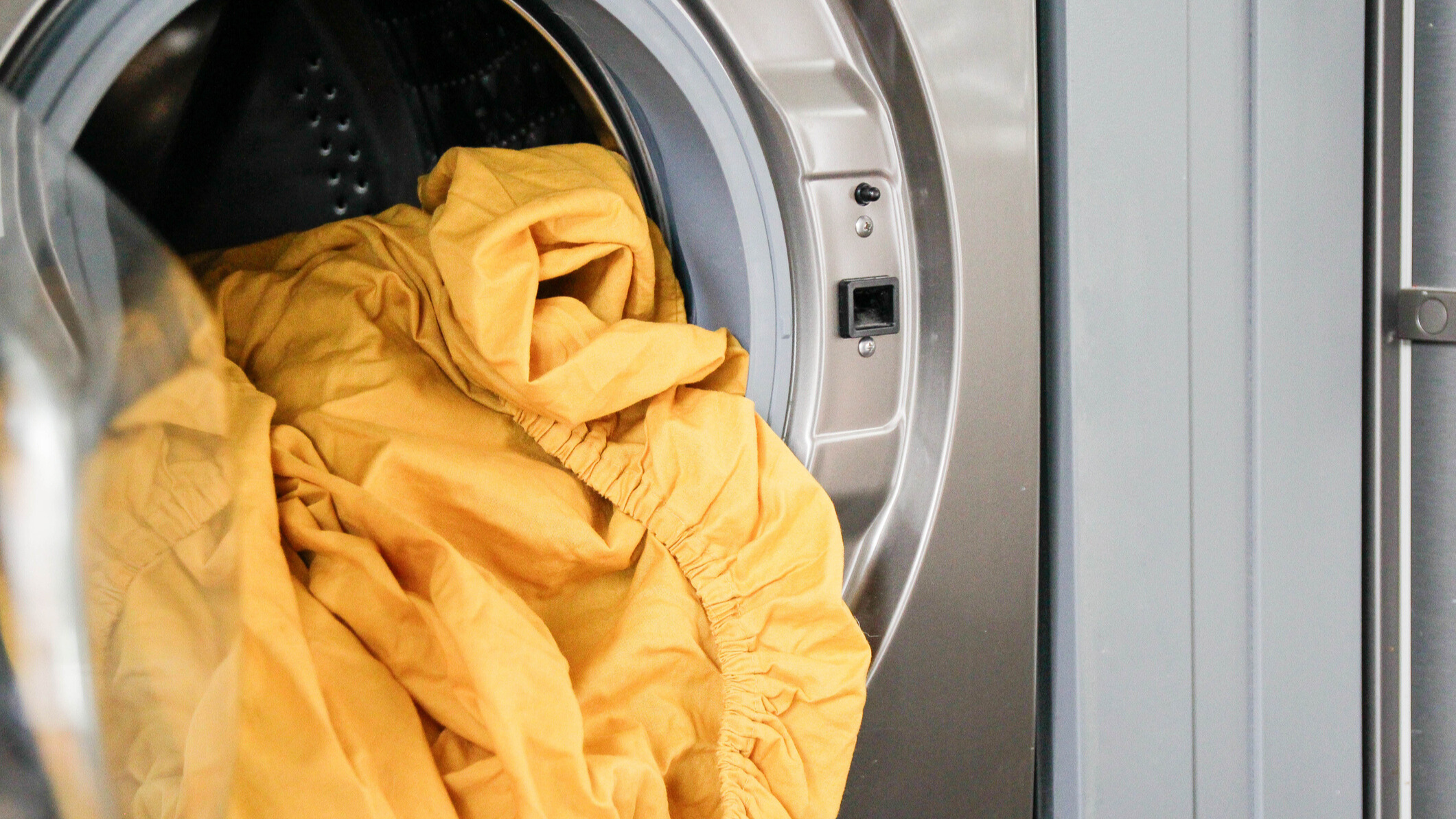 White bedsheets in the washing machine