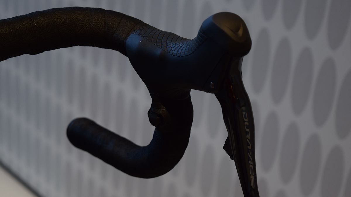 Gilbert runs satellite Di2 sprint shifters on his handlebar drops for easy shifting on the cobbles