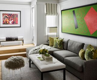 Family room with sofa and bright artwork