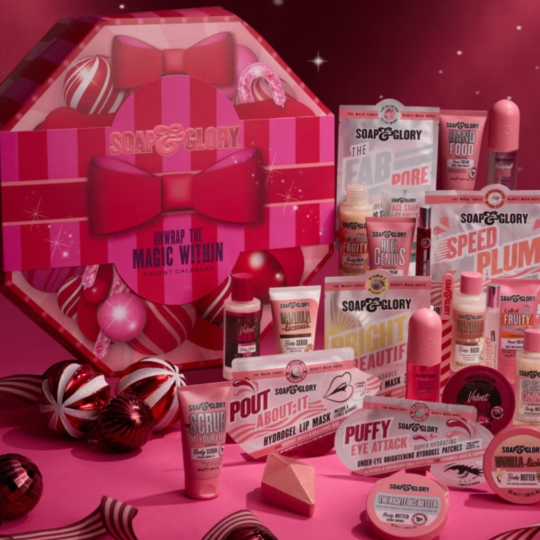 Soap &amp;amp; Glory Unwrap The Magic Within 24 Piece Advent Calendar with its contents in front of it