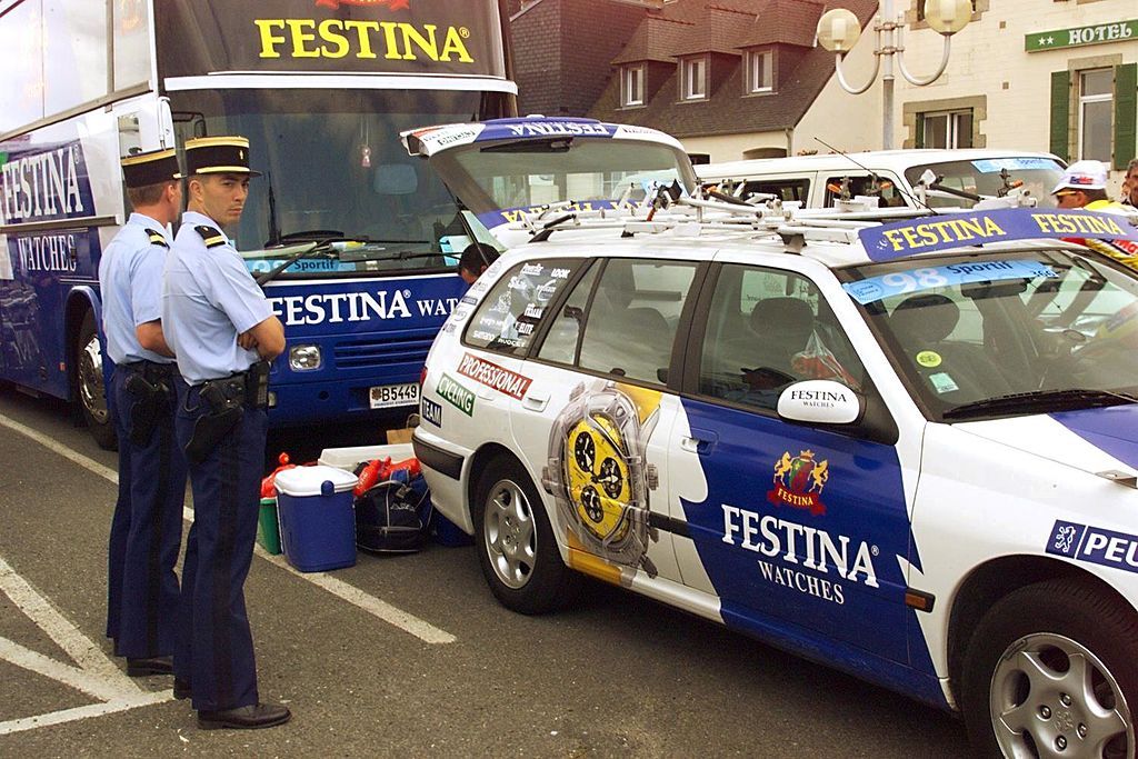 Policemen surround the Festina camp