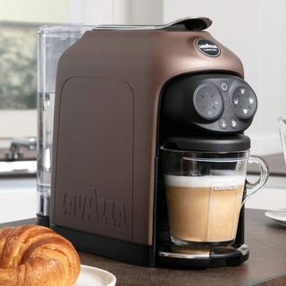 Lavazza Desea in walnut brown colorway on kitchen countertop with croissant pastry on plate
