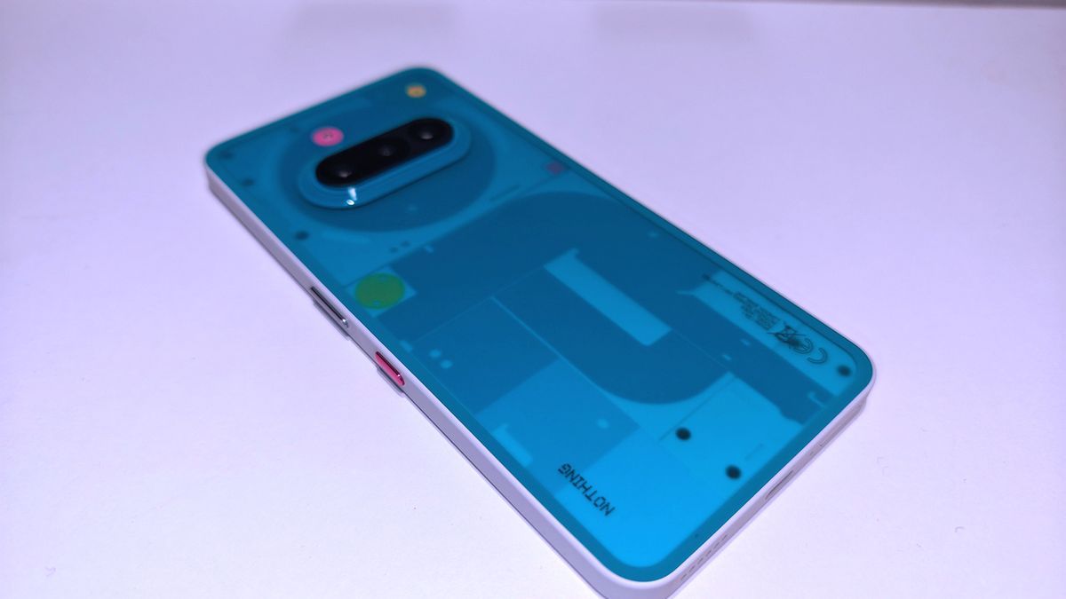 Nothing 3a Community Edition, a green phone on a white table