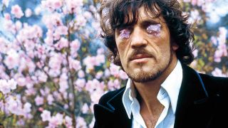 Jim Capaldi with flower petals on his eyes 