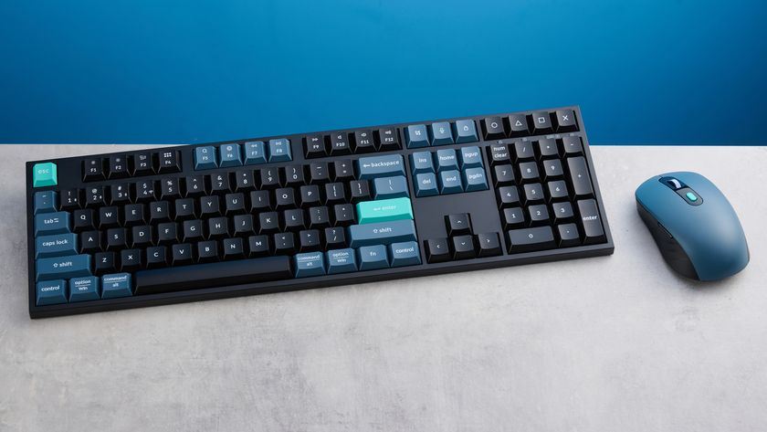 Keychron B36 keyboard and Keychron BM25 mouse photographed in front of a blue background. 