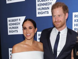 Prince Harry and Meghan Markle on a red carpet