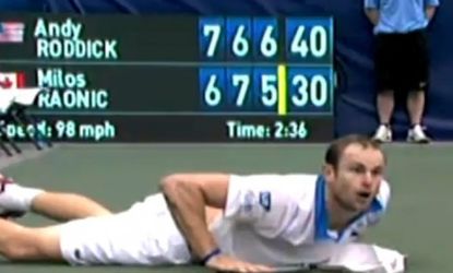 Andy Roddick dives to hit what could have been the point-ending shot by opponent Milos Roanic and wins the weekend tournament. 