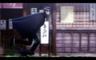 A screenshot from Raidou Remastered showing the protagonist, Raidou, dashing down a Tokyo street with his cat companion Gouto