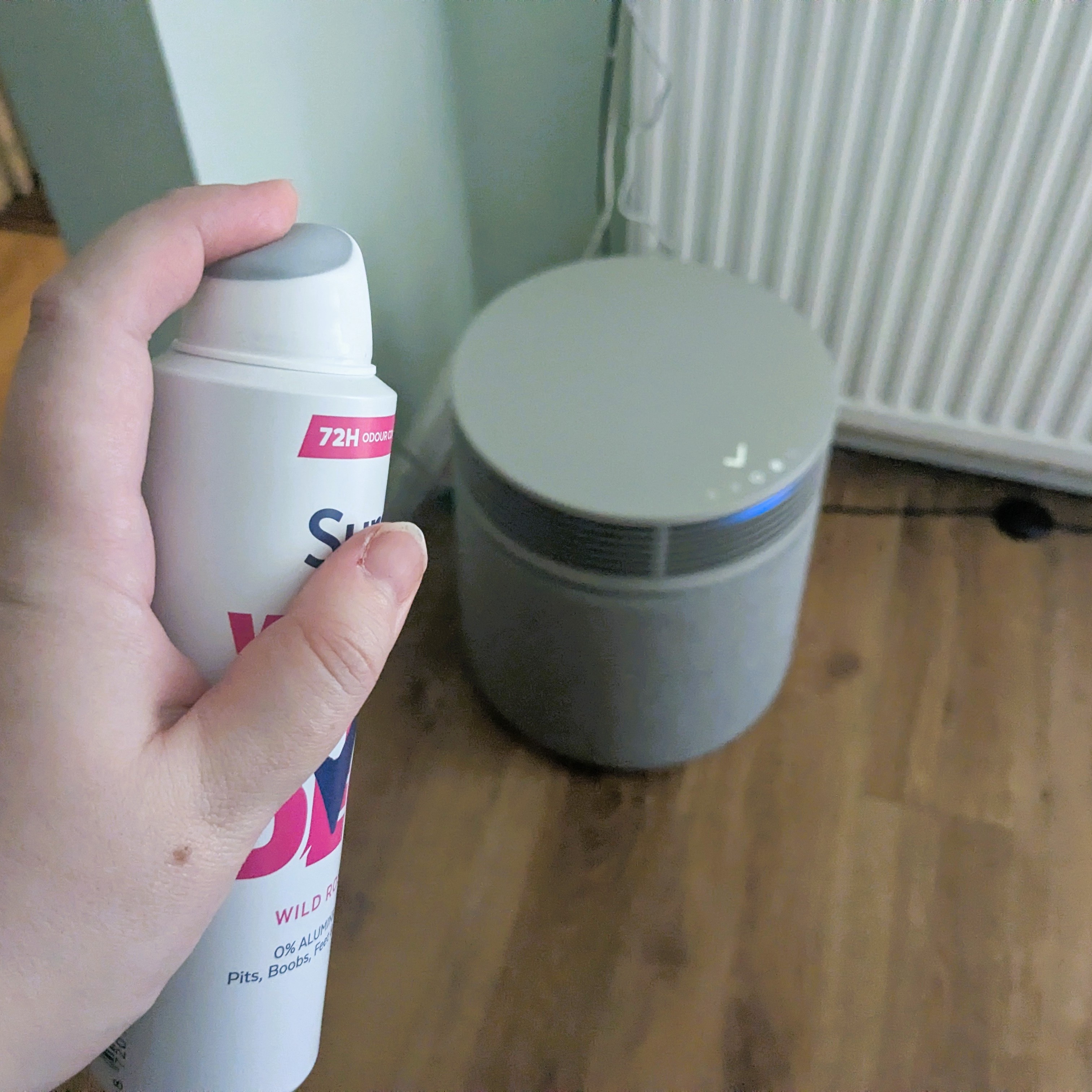 Blueair Signature Blue with aerosol deoderant being pointed at it