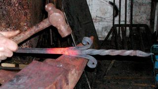 Iron railings are made using traditional methods at a blacksmith