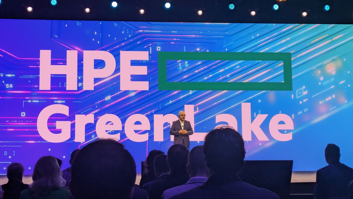 Keynote stage at HPE Discover Barcelona, with the words &quot;HPE GreenLake&quot; on stage. Standing on the stage is Antonio Neri, CEO at HPE.