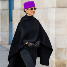 Fashion person Nina Sandbech wears the french women poncho trend. 