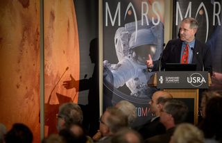 John Grunsfeld, NASA’s associate administrator for science, speaks Oct. 27 during the First Landing Site/Exploration Zone Workshop for Human Missions to the Surface of Mars held at the Lunar and Planetary Institute in Houston. NASA hosted the workshop to collect proposals for locations on Mars that would be of high scientific research value while also providing natural resources to enable human explorers to land, live and work safely on the Red Planet.