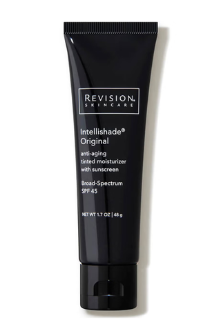 A tube of Revision Intellishade sunscreen set against a white background.