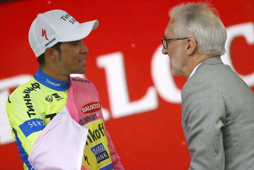 UCI President Brian Cookson and race leader Alberto Contador chat on the stage 12 podium