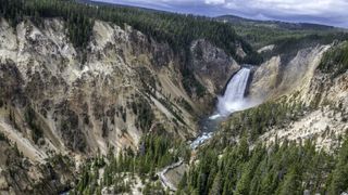 Waterfalls plunge over cliffs where soft rock has been eroded by running water