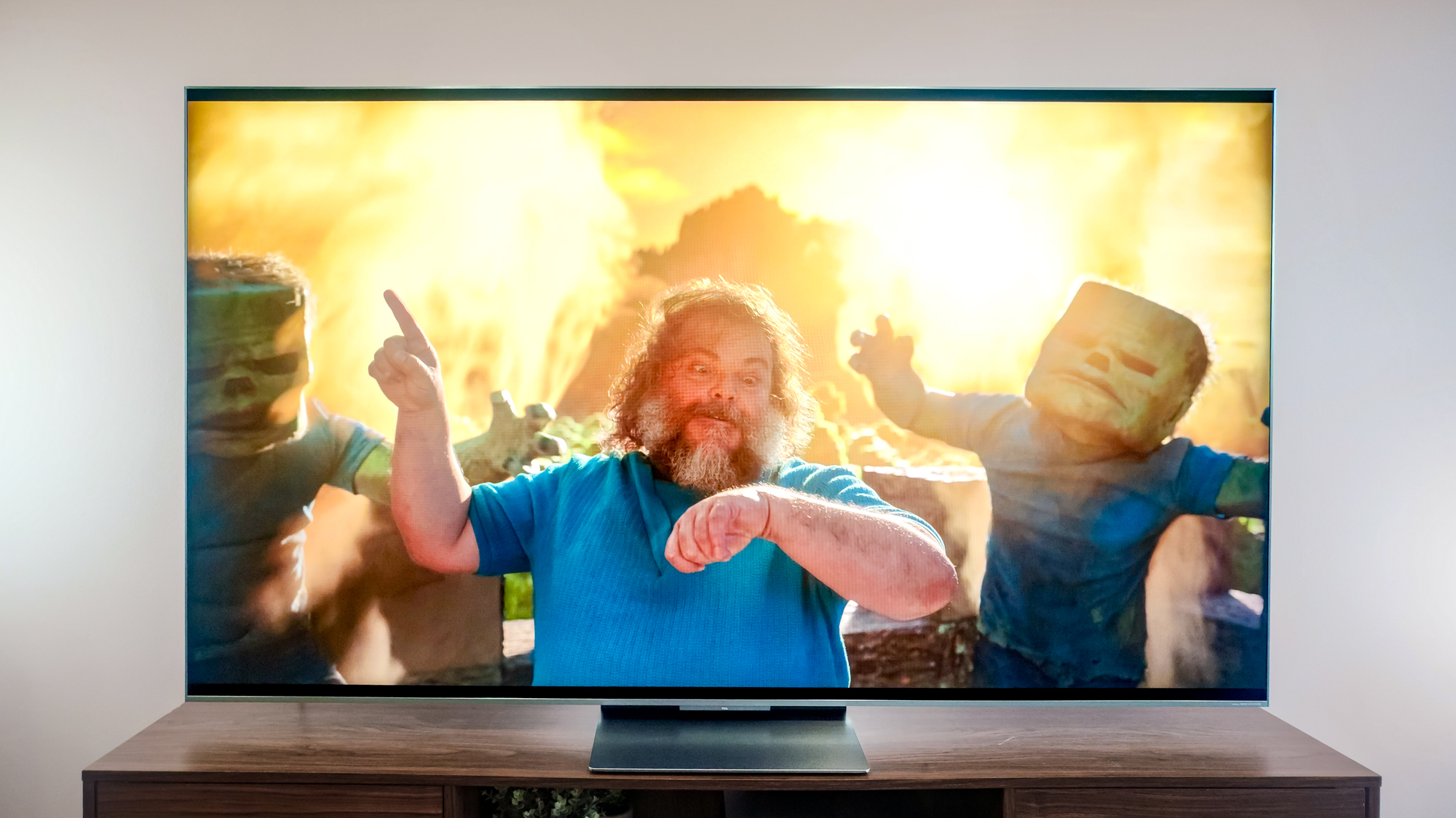 A TCL QM9K TV on a side table