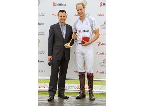 ''Is it nappies?'': Prince William is presented with a present for George