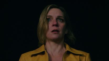 Rhea Seehorn as Carol Sturka, looking scared, in Pluribus.