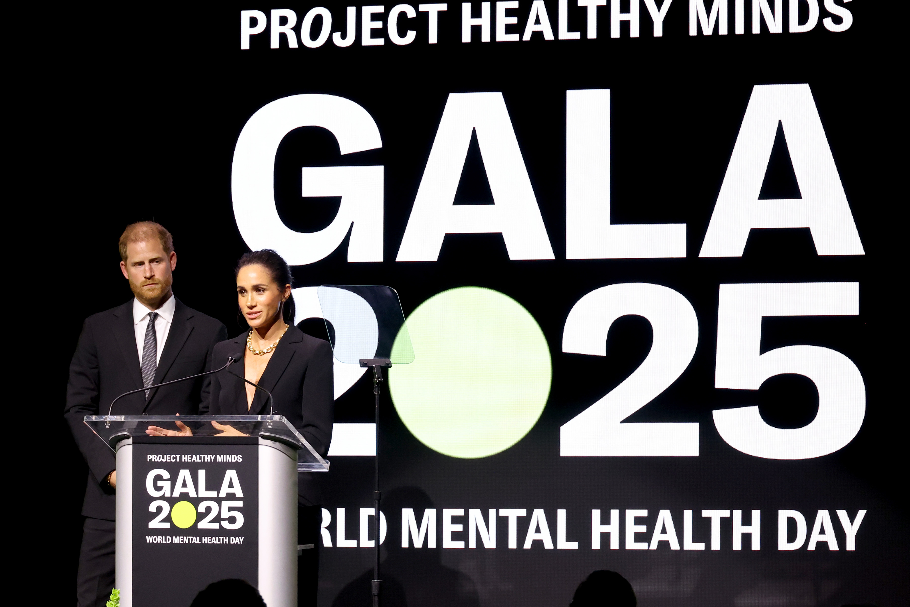 Meghan Markle and Prince Harry accepting an award at Project Healthy Minds gala