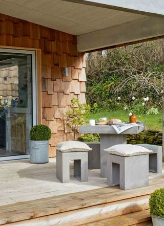 modern outdoor furniture ideas with concrete table and concrete outdoor chairs