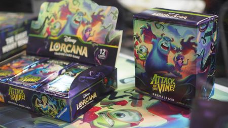 Disney Lorcana Attack of the Vine Prerelease and Booster Box on a play mat