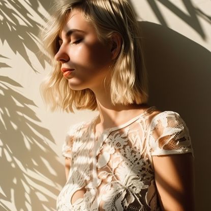 Woman in a wedding dress with shadows of plants