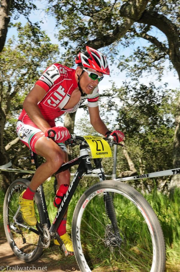 Brady Kappius (Cliff Bar) climbs under the shade trees