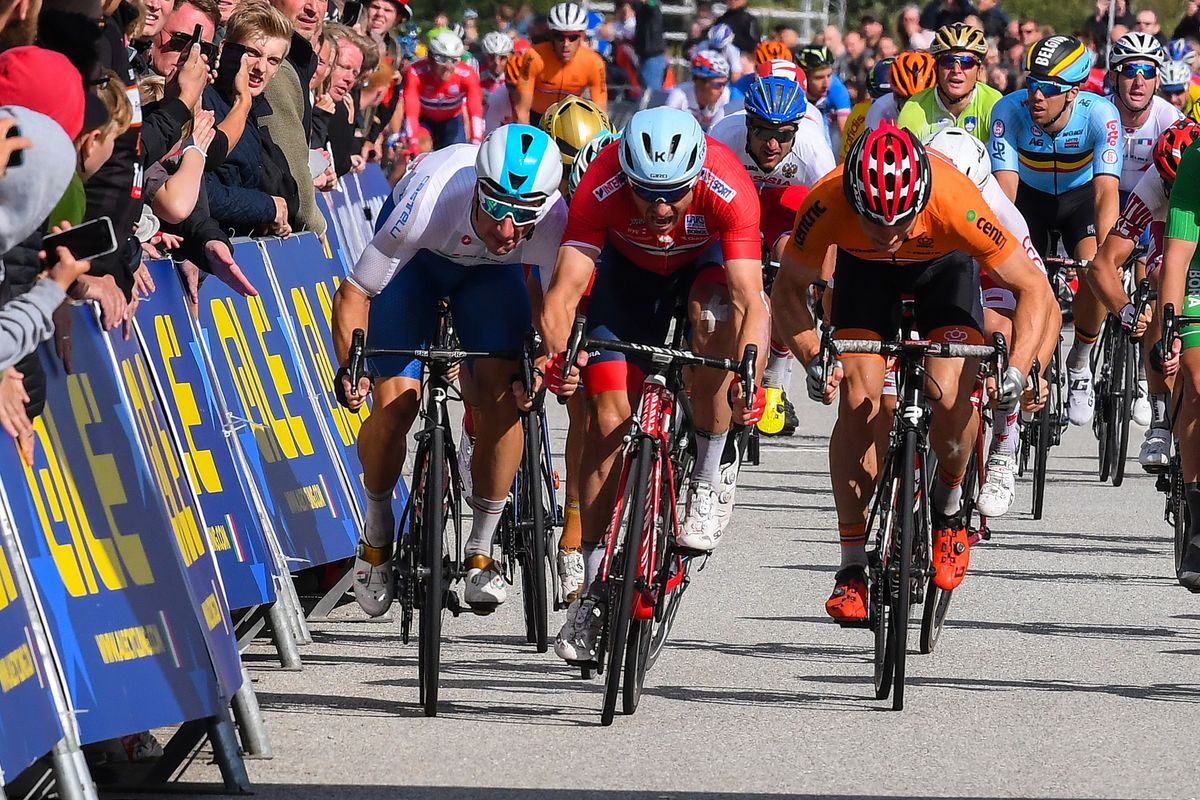 Elia Viviani (Italy) bumps Alexander Kristoff (Norway) in the sprint