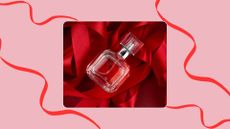 An image of a bottle of perfume sitting on a bed of red ribbon, to illustrate gifting perfume