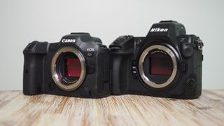 Nikon Z8 vs Canon EOS R5 – the Z8 and R5 sit, side by side, on a wooden surface against a white background